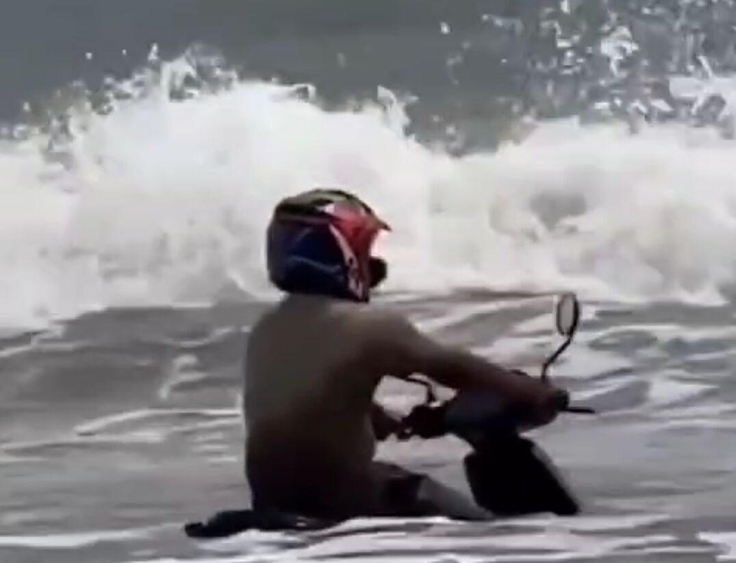 Man Rides Scooter into Sea, Becomes Internet Sensation