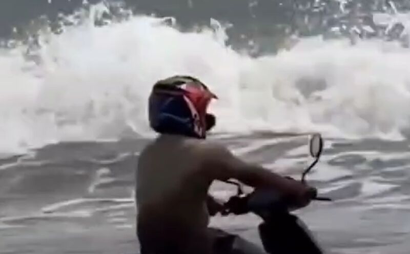 Man Rides Scooter into Sea, Becomes Internet Sensation Man Rides Scooter into Sea, Becomes Internet Sensation